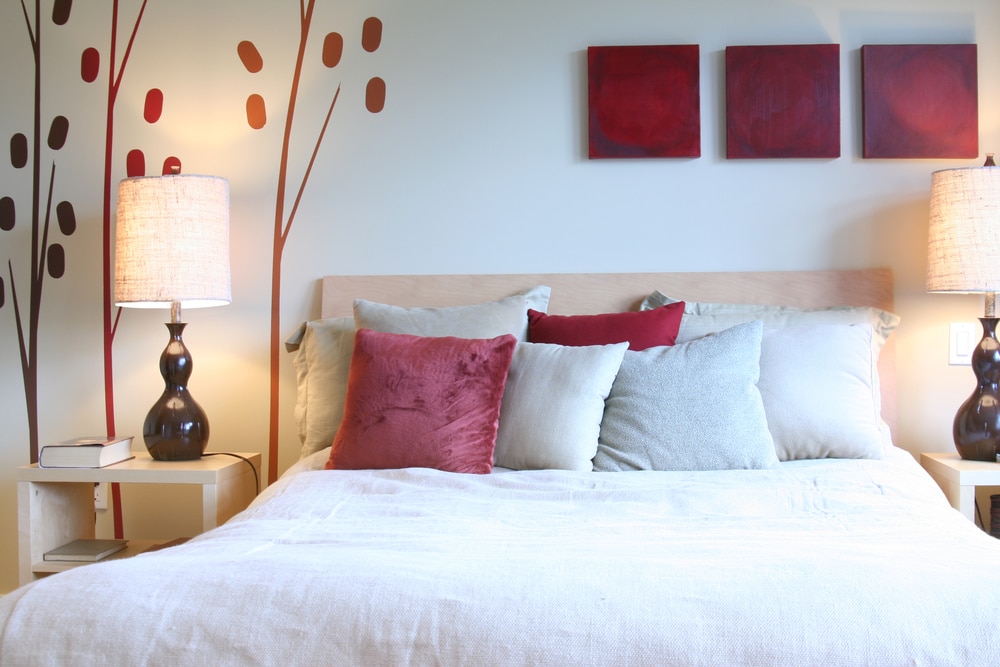 neutral bedroom with red as an accent